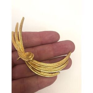 #76 Monet signed vintage Goldtone swag pin brooch